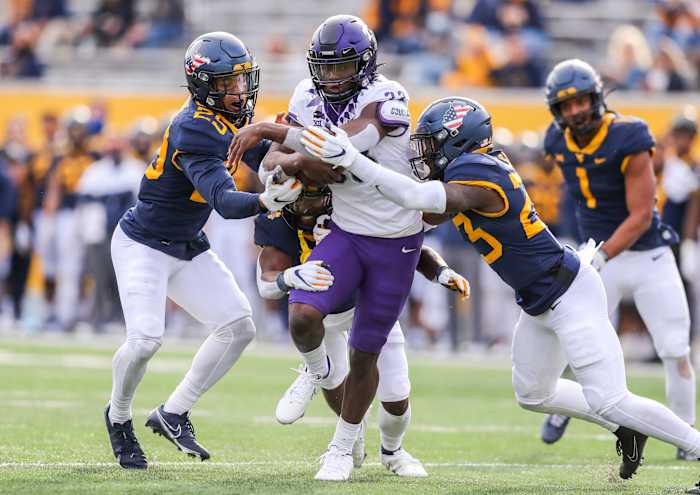Nov 14, 2020; Morgantown, West Virginia, USA; TCU Horned Frogs running back Kendre Miller (33) runs the ball during the third quarter against the West Virginia Mountaineers at Mountaineer Field at Milan Puskar Stadium.